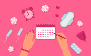 tampons, calendar, clock on pink background - a menstruation concept 