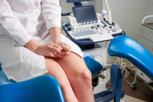 Woman at gynecologist office sitting and waiting for a doctor