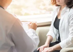 gynecologist talking to woman