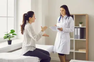 Patient talking to gynecologist about abnormal pap smear