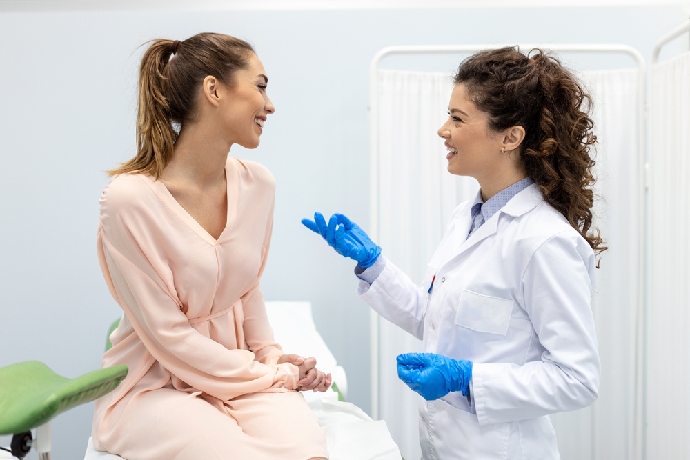 woman talking to female doctor in office